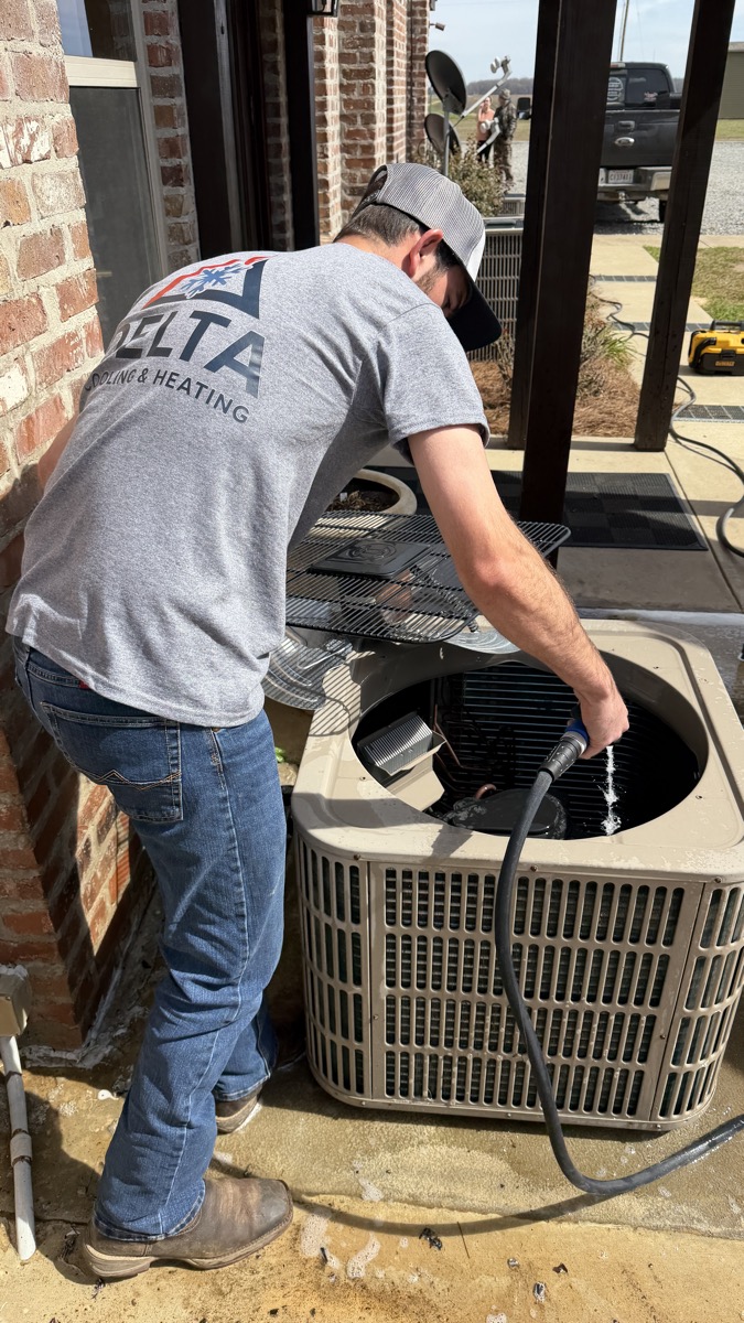 Delta Cooling technician performing preventive HVAC maintenance